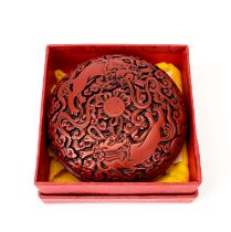 A boxed Chinese cinnabar lacquer box, Dia. 10cm.
