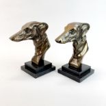 A pair of Art Deco style bronze greyhound heads on marble bases, H. 22cm.