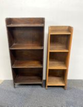 Two small oak bookcases together two standard lamps.