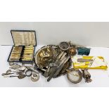 A box of silver plated items.