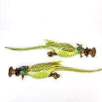 A pair of ormolu mounted porcelain parrot wall candle holders, H. 47cm.