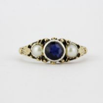 A Victorian yellow metal (tested 9ct gold) ring set with sapphire and split pearls, (L.5).