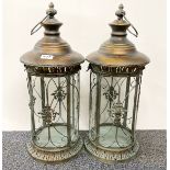 A pair of gilt metal and glass garden storm lanterns, H. 56cm.