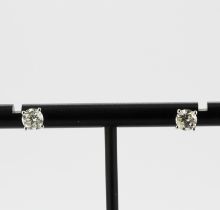 A pair of 18ct white gold solitaire stud earrings each set with a brilliant cut diamond, approx. 1.