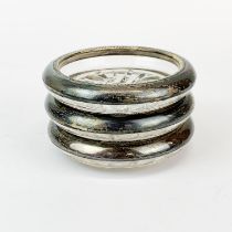 A set of three sterling silver and glass coasters, Dia. 9.5cm.