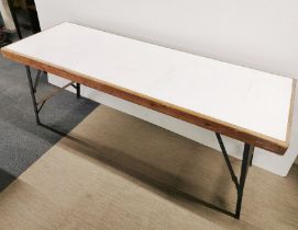 A heavy folding workman's table, 178 x 62cm.