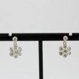 A pair of 18ct white gold flower shaped drop earrings set with brilliant cut diamonds, total approx.