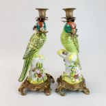 A pair of large ormolu mounted continental porcelain parrot candlesticks, H. 45cm.