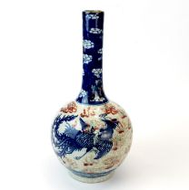 A lovely Chinese porcelain vase with underglaze blue and red decoration of a dragon among clouds, H.