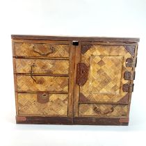 A 19th century Japanese marquetry decorated jewellery box, 35 x 23 x 26cm.