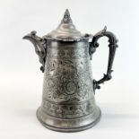 A large 19th century hammered pewter jug, H. 31cm.