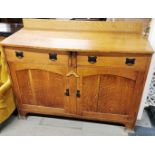 An oak two drawer sideboard, 133 x 105 x 58cm.