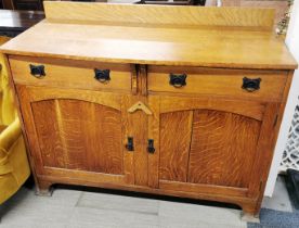 An oak two drawer sideboard, 133 x 105 x 58cm.