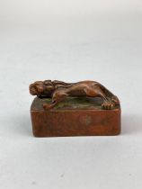 A Chinese bronze scholar's seal mounted with a young dragon, L. 5.5cm.