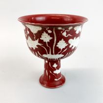 A Chinese sang de boeuf glazed porcelain stem cup, H. 15cm, Dia. 17cm.