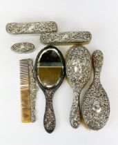 A seven piece hallmarked silver dressing table set.