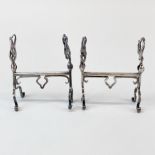 A pair of white metal Charles Horner style knife rests, some indistinct marks, H.8, W. 6cm.