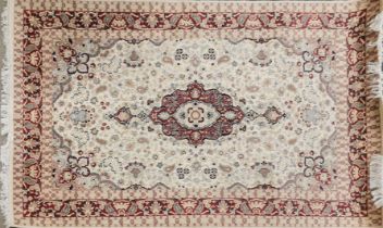 An eastern wool cream ground rug, 280 x 185cm.