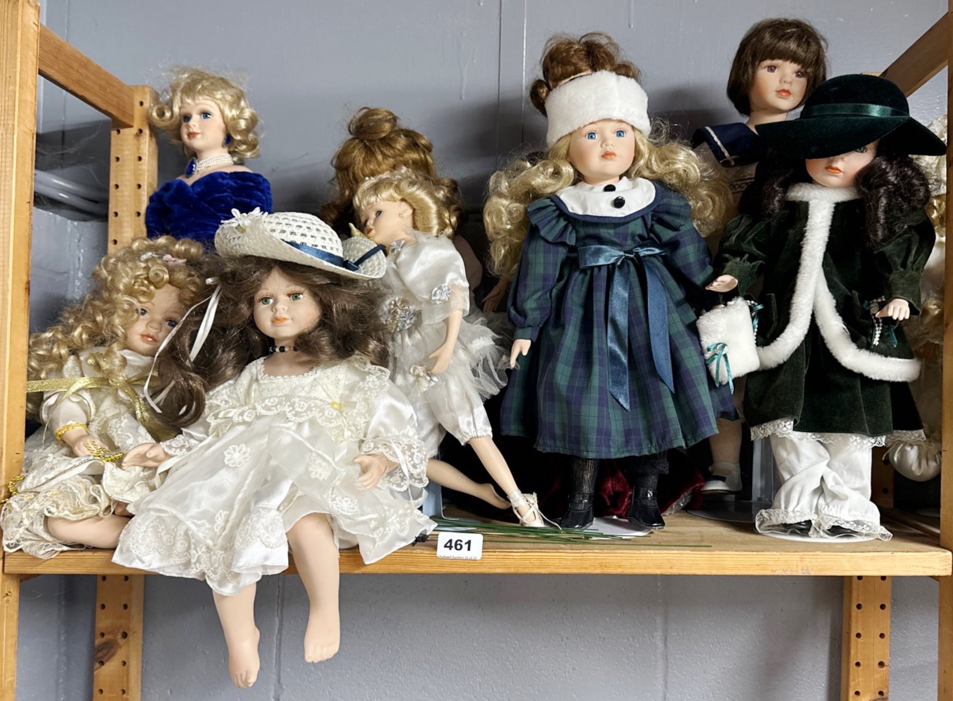 A group of porcelain collectors dolls, tallest H. 52cm.
