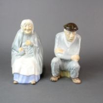 A pair of Irish porcelain figures of a elderly couple, H. 20cm. One is A/F to nose.