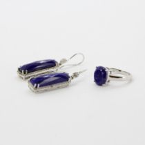 A 925 silver ring set with a faceted oval cut lapis lazuli, size O. Together with a pair of 925