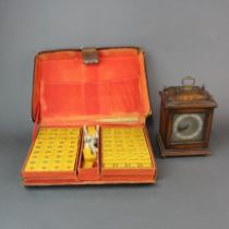A leather cased Mahjong set together with an oak mantle clock with replacement battery movement.