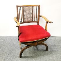 A re-upholstered beech armchair with rattan and turned beechwood backing, H. 75cm.