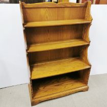 A lovely Ercol elm Waterfall Golden Dawn bookshelf, H. 127cm W. 87cm D. 33cm. (Design 983)