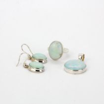 A suite of 925 silver and opal jewellery, comprising a pendant, earrings and ring, size O.5.