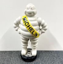 A painted cast iron figure of the Michelin Man, H. 38cm.