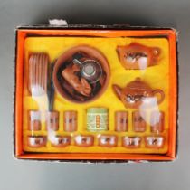 An unopened Chinese terracotta tea set.