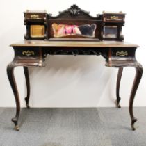 An elegant Edwardian Mahogony ladies desk with inset leather and brass galleries, W. 103cm, H.