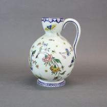 An early 20th century Gien faience jug, H.23 cm.