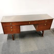 A teak G Plan E Gomme dressing table with five drawers, 1 cupboard and plate glass top, 155 x 71 x