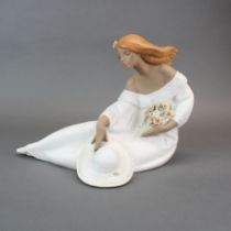 A large Lladro porcelain figure of a young woman with a bouquet of flowers, L. 35cm, H. 26cm. Very