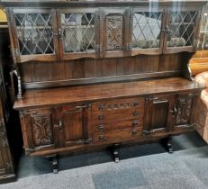 A heavy quality carved dark oak cabinet over sideboard, 187 x 163 x 43cm.