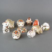 A group of ten Royal Crown Derby porcelain paper weights.