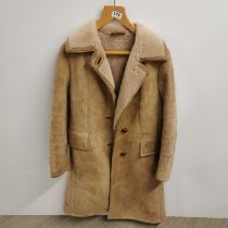 A ladies Sheep skin coat, Shoulder W. 44cm.