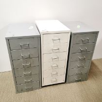 A pair of six drawer metal filing cabinets together with a further six drawer filing cabinet,