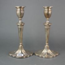 A pair of large weighted hallmarked silver candlesticks, H. 31cm.