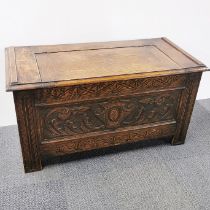 A 1920's carved oak coffer, 88 x 44 x 45cm.