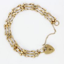A hallmarked 9ct yellow gold gate bracelet. Safety chain A/F.