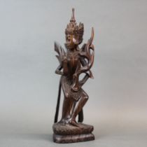 An Indonesian carved rosewood figure of a Hindu dancer, H. 35cm.