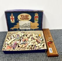 A Great Western Railway wooden jigsaw puzzle, together with a cribbage board and pegs.