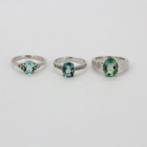 Two 925 silver rings set with oval cut green amethyst, one also with clear quartz shoulders.