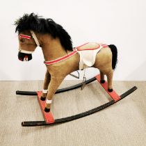 An early 20th C. child's rocking horse, L. 85cm H. 66cm.