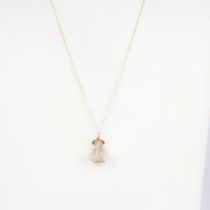 A 14ct (stamped 14k) yellow gold mounted rose quartz buddha pendant, on a hallmarked 9ct yellow gold