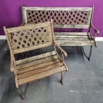 A cast iron garden bench, L. 126cm. H. 76cm. together with a matching cast iron garden seat.