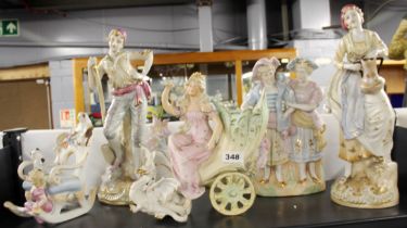 A group of Victorian and other porcelain figurines, tallest H. 46cm.