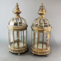 A pair of bronzed metal garden lanterns, H. 61cm.